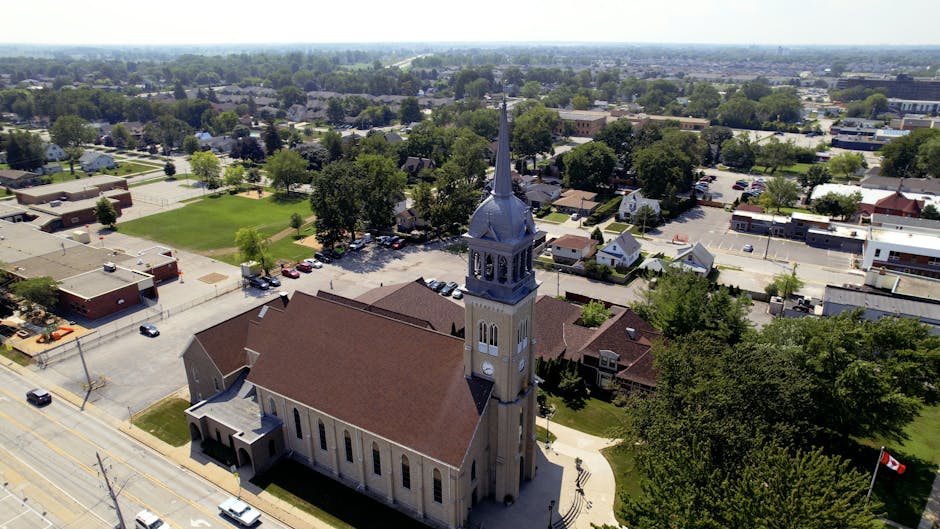 A stunning aerial photograph showcasing a historic church in Windsor with surrounding townscape.